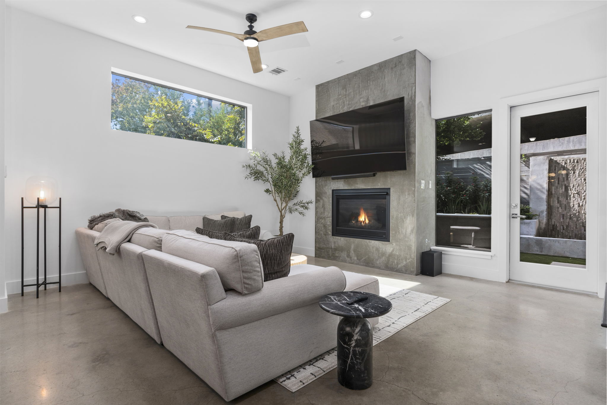 Living room with concrete fireplace